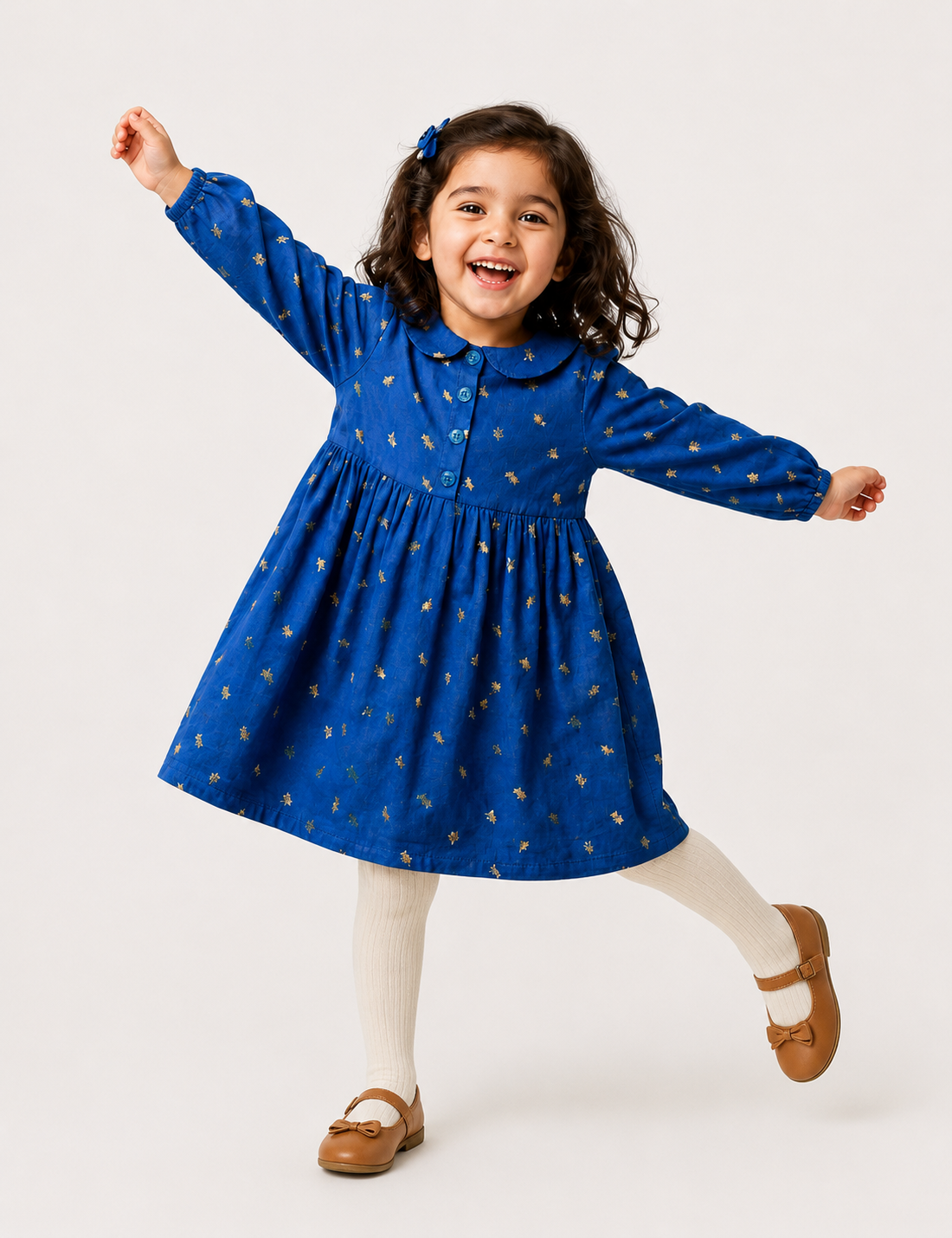 Twirling girl in Gold Foil Blue Collar Dress, a joyful pick from Kissa's girl clothes