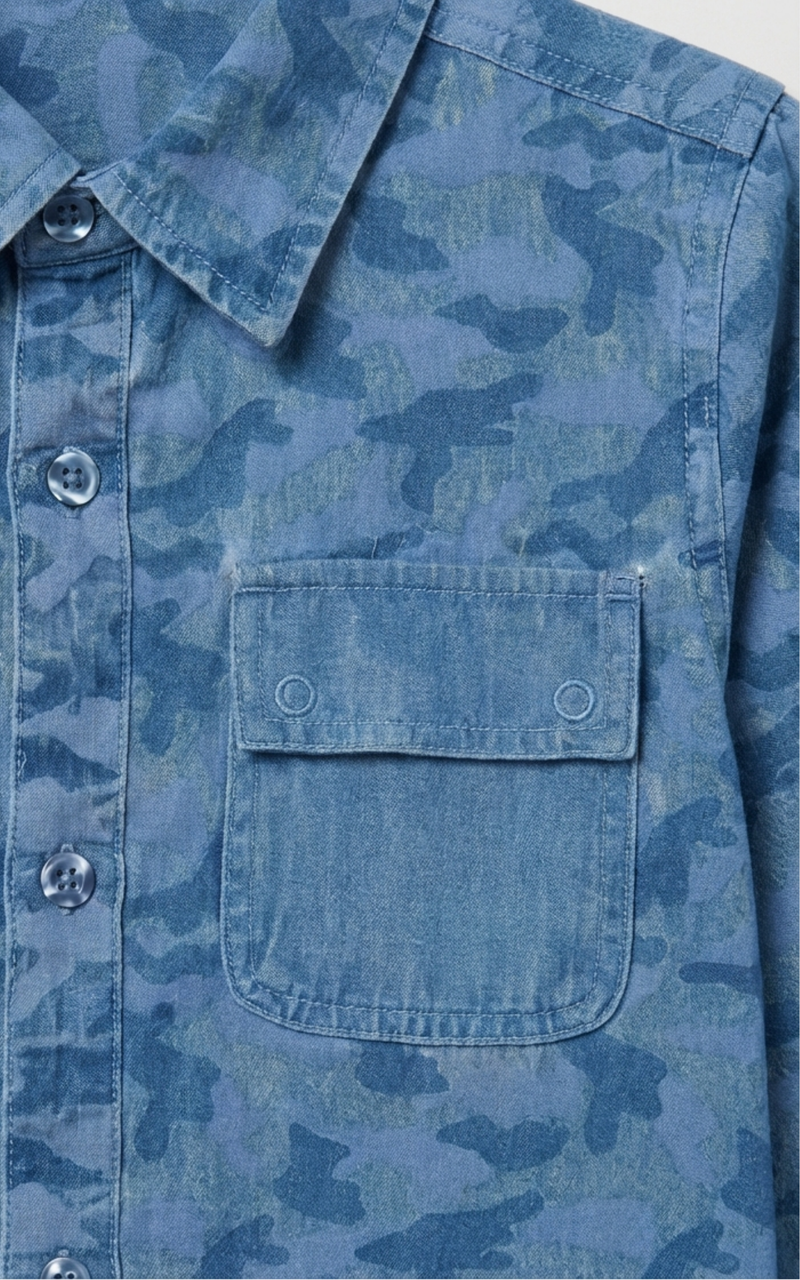 Closeup of flap pocket and buttons on Boys Denim Camo Shirt, one of Kissa's boys cotton shirts