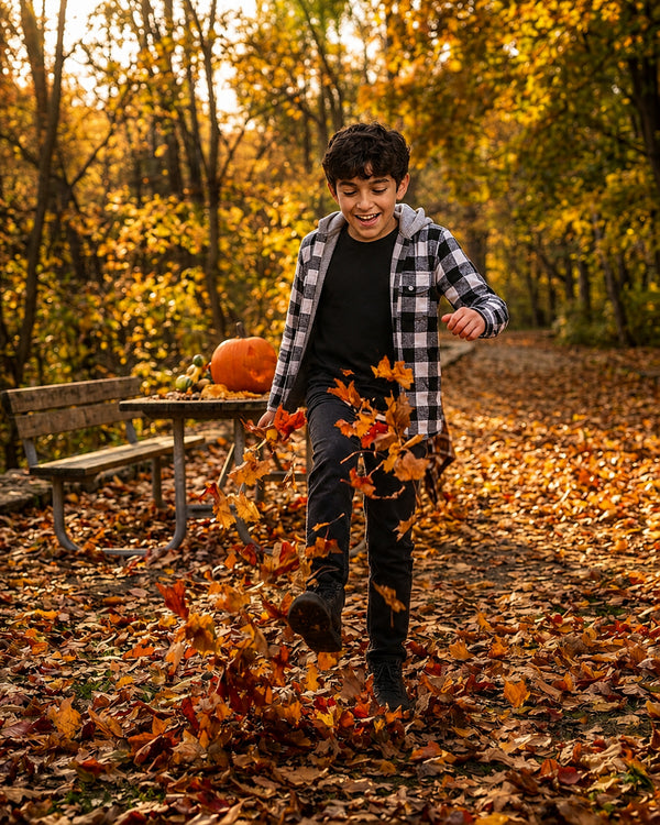 Boy kicking autumn leaves in Black White Shacket with Hood, cheerful fall outfits for boys