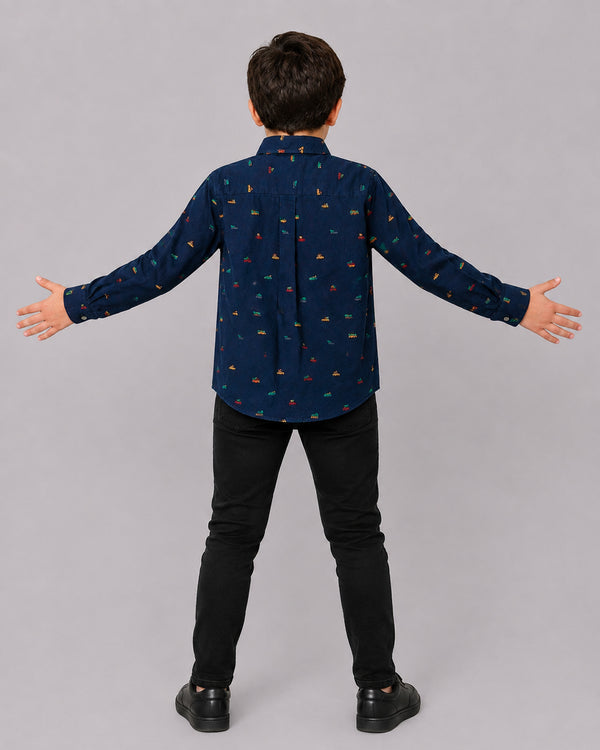 Boy in Navy Christmas Print Shirt, back view, part of Kissa's boys clothing collection