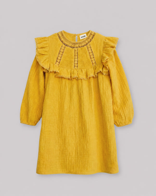 Flat lay of mustard yellow dress with crochet lace and ruffle yoke, cute toddler girl dresses
