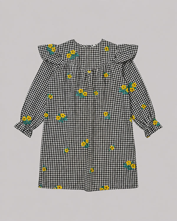 Flat lay of black and white check dress with ruffle collar and floral embroidery, cute toddler girl dresses