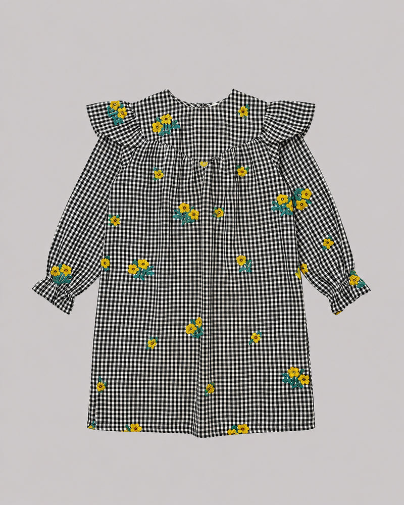 Flat lay of black and white check dress with ruffle collar and floral embroidery, cute toddler girl dresses