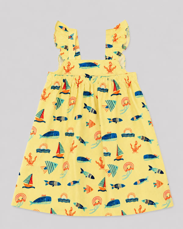 Girls ocean themed dress in yellow, sailboat and fish print, flat lay