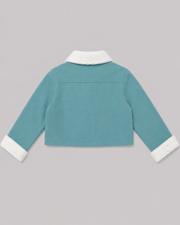 Back view of teal fleece jacket with cream sherpa collar and cuffs, from Kissa's coats and jackets range