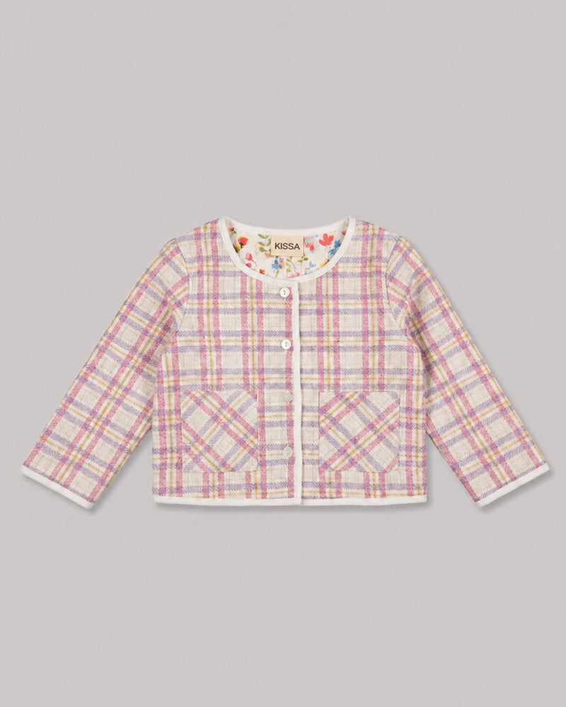 Flat lay of pink tweed plaid jacket with patch pockets and pearl buttons, a classic girls jacket