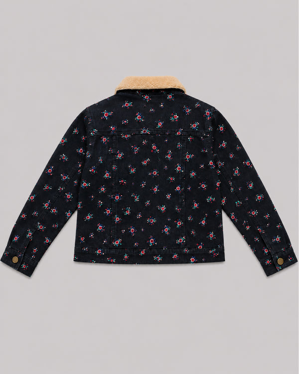 Back view of navy floral print denim jacket with tan sherpa collar, a warm girls jacket