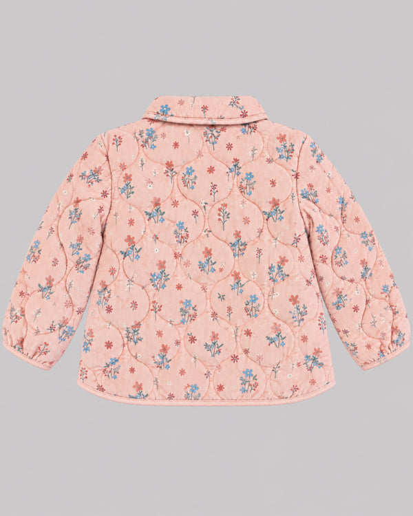 Back view of dusty pink floral quilted jacket with scalloped collar, part of Kissa's coats and jackets line