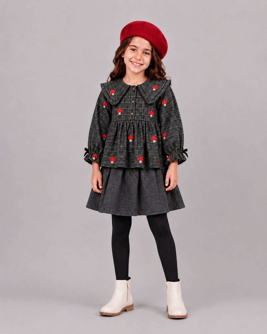 Smiling girl in grey houndstooth mushroom top and skirt, red beret - girls clothing outfit